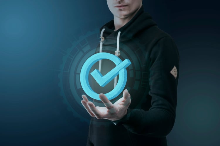 A person holding a check mark logo for what is zero trust access
