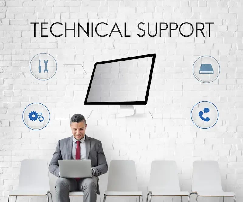 A man working on his laptop as a technical IT Support