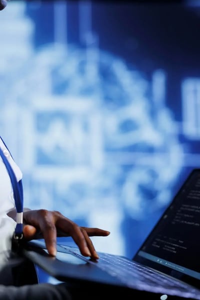 An-it-managed-services-professional-holding-a-laptop