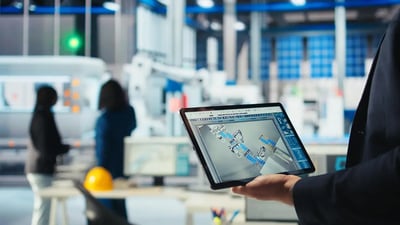 An-expert-using-a-tablet-for-manufacturing-IT-Services.webp