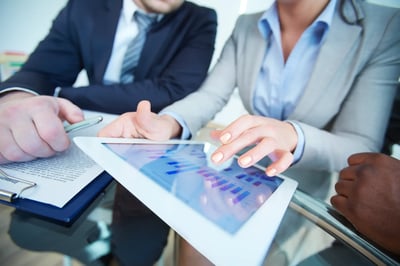 businesswoman showing graph on a digital tablet with Financial IT Solution
